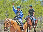 A boy shows his excitement while riding a horse (one of the favorite activities that Reid Ranch offers).