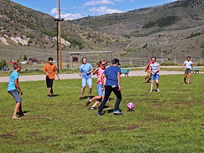 Boys versus girls in a game of soccer.