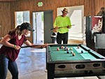 Guests play pool inside the Conference Center.