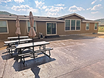 Back patio with picnic tables.