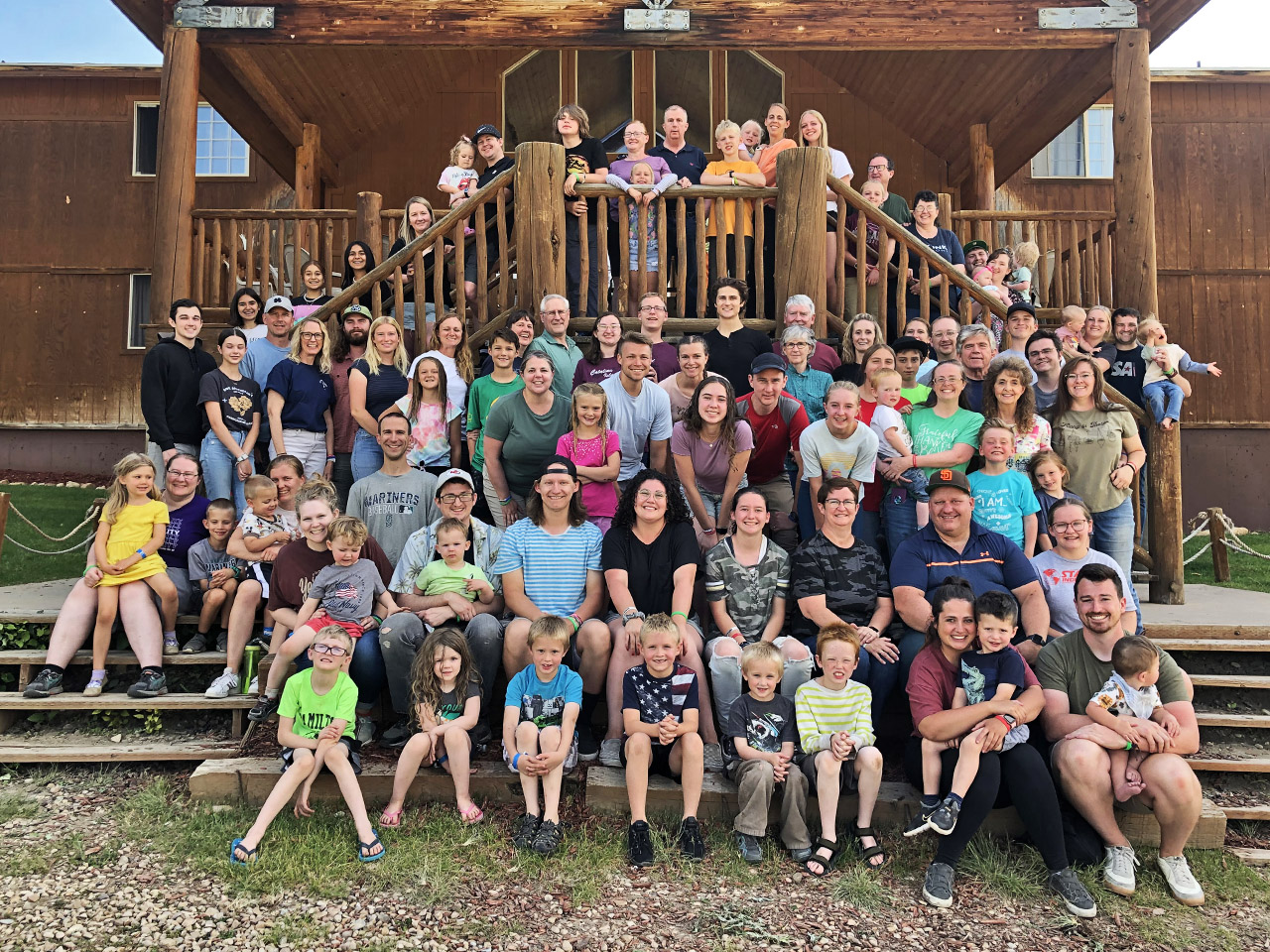 A large family in front of the Tabby Mountain Lodge.